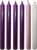 SGI Online advent candle set with four purple, one pink, and one white tall candles