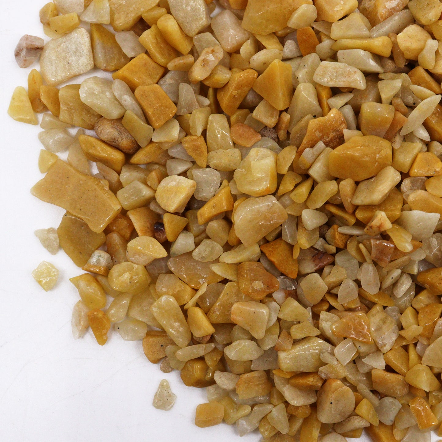 Polished golden quartz gemstone chips in various shapes and shades of yellow and gold SGI Online