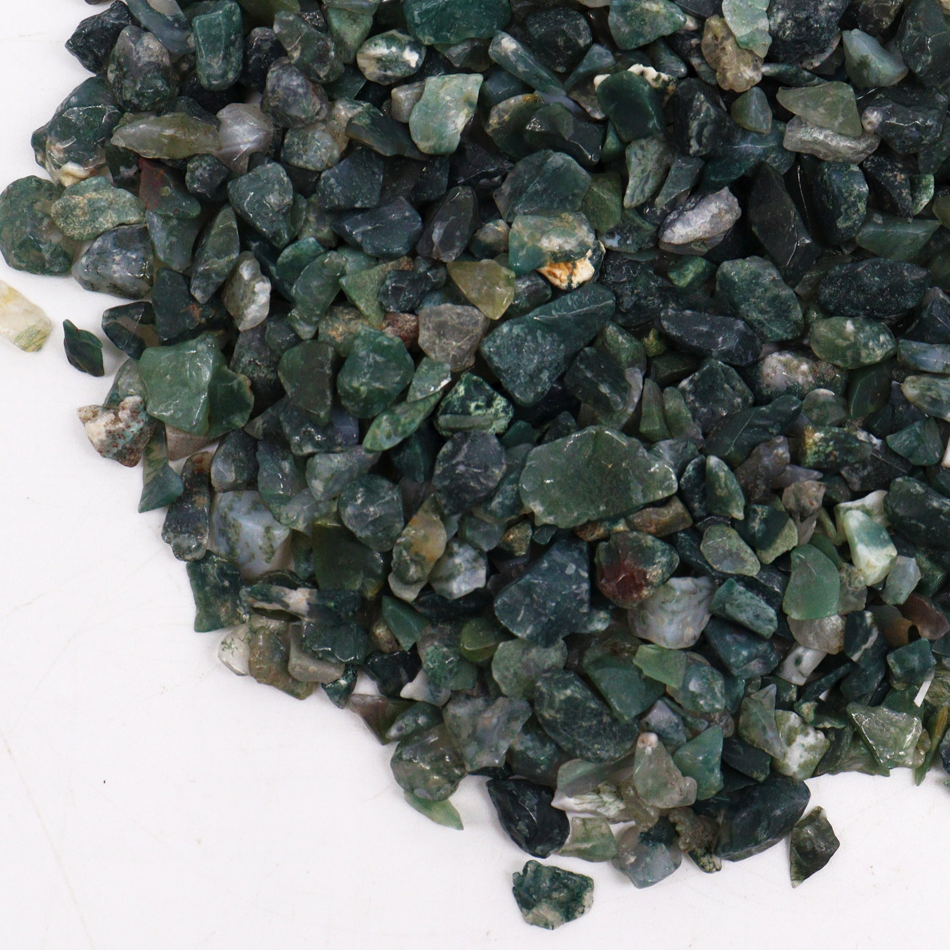 Polished moss agate gemstone chips in various green shades from SGI Online