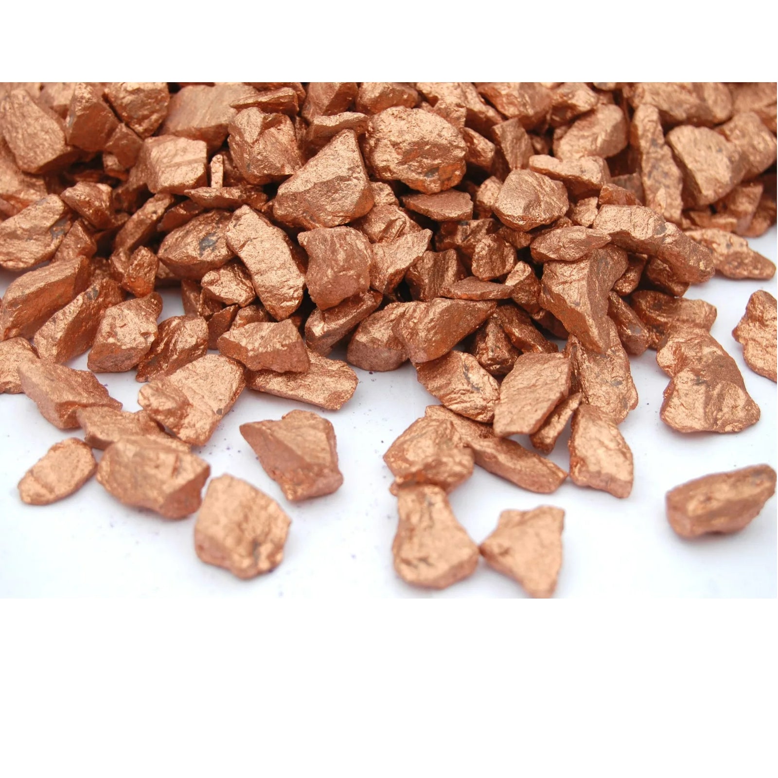 Close-up of copper quartz crystal chippings in metallic copper color for decorative landscaping