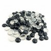 Pile of black and clear glass pebbles from STONED for decorative use