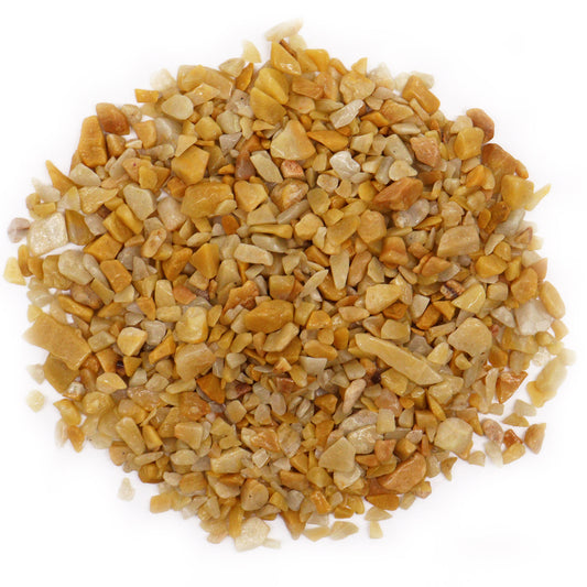 Pile of polished golden quartz gemstone chips in various shades of yellow and gold SGI Online