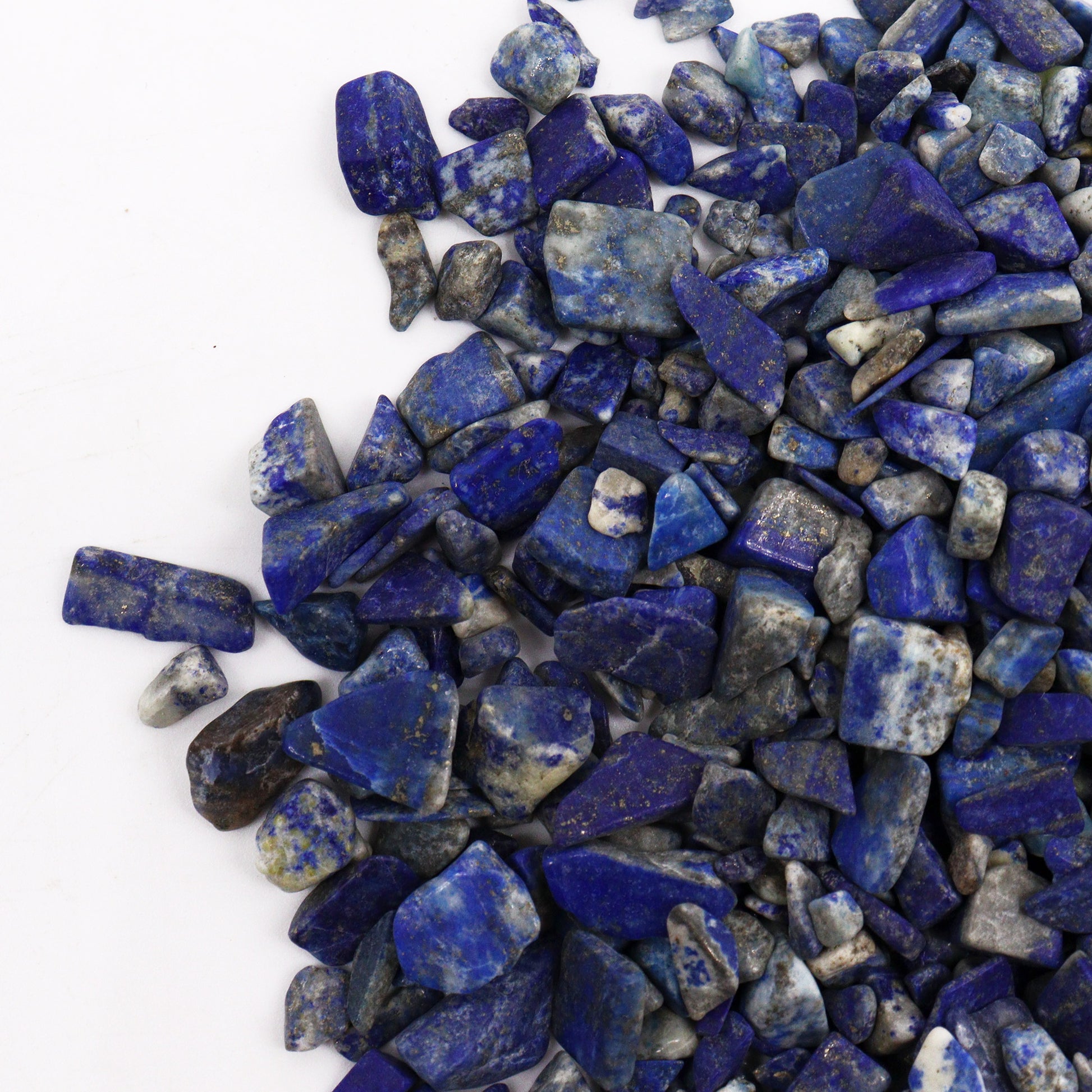 Polished lapis gemstone chips in various shapes and shades of deep blue from SGI Online