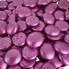 Close-up of metallic pink glass pebbles by STONED decorative smooth shiny stones
