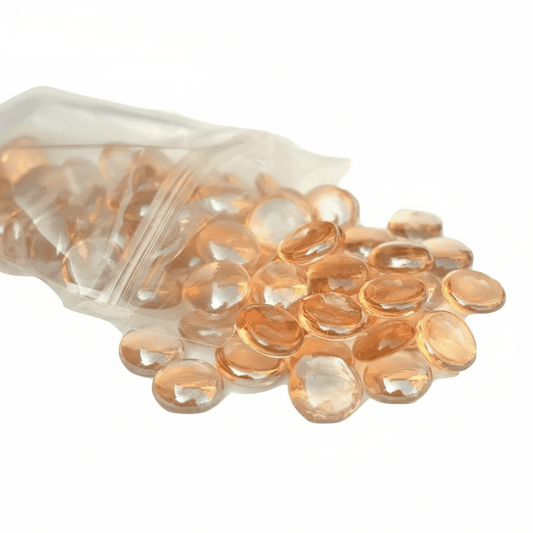 STONED peach glass pebbles spilling from a clear resealable bag with smooth rounded shapes SGI Online