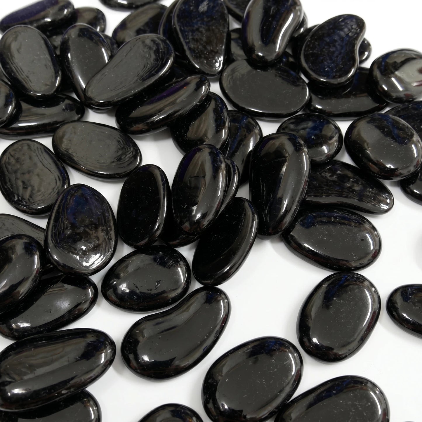 Black polished glass decorative pebbles with smooth glossy finish for home and garden decor SGI Online