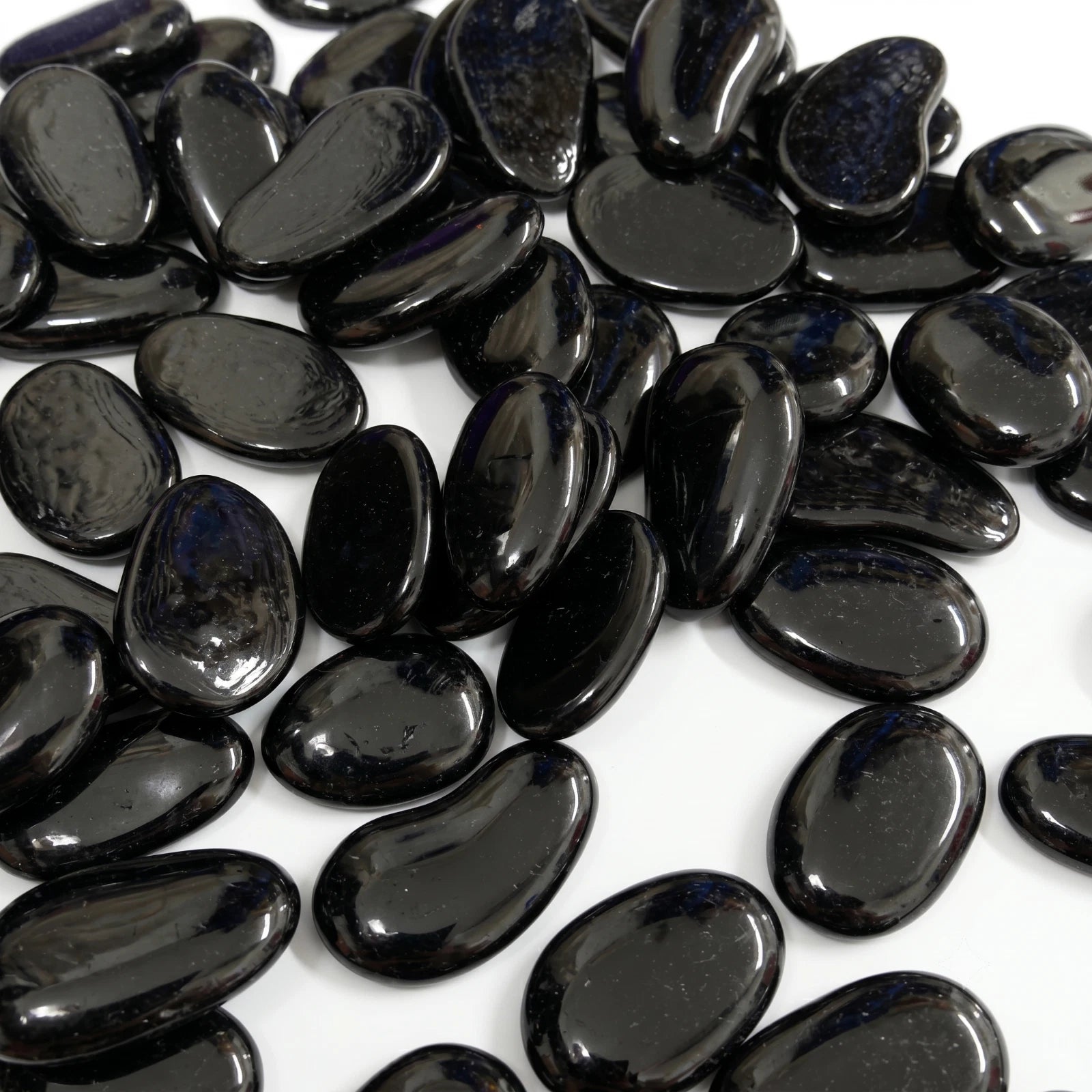 Black polished glass decorative pebbles with smooth glossy finish for home and garden decor