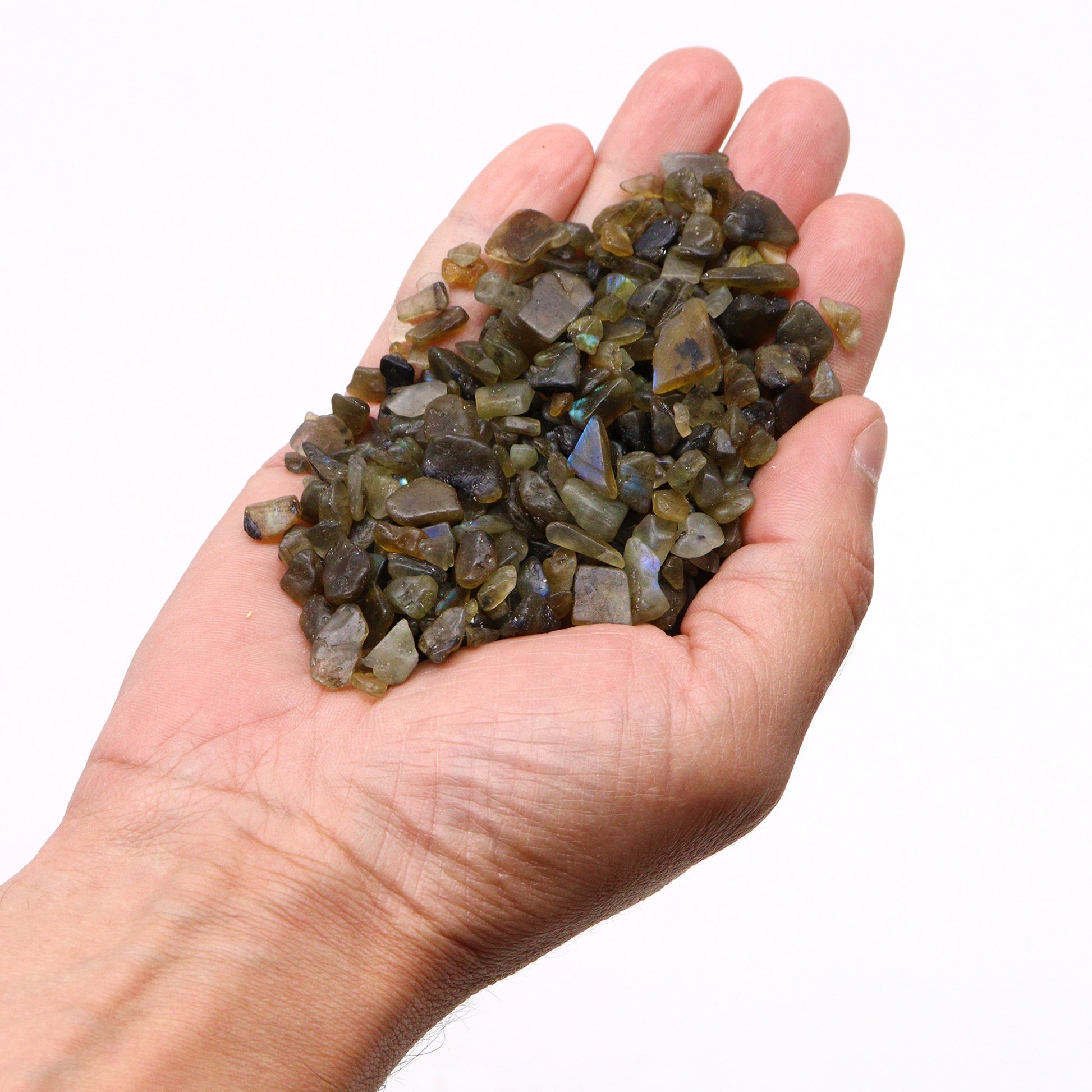 Hand holding polished tiger eye gemstone chips 1kg with brown and gold hues from SGI Online