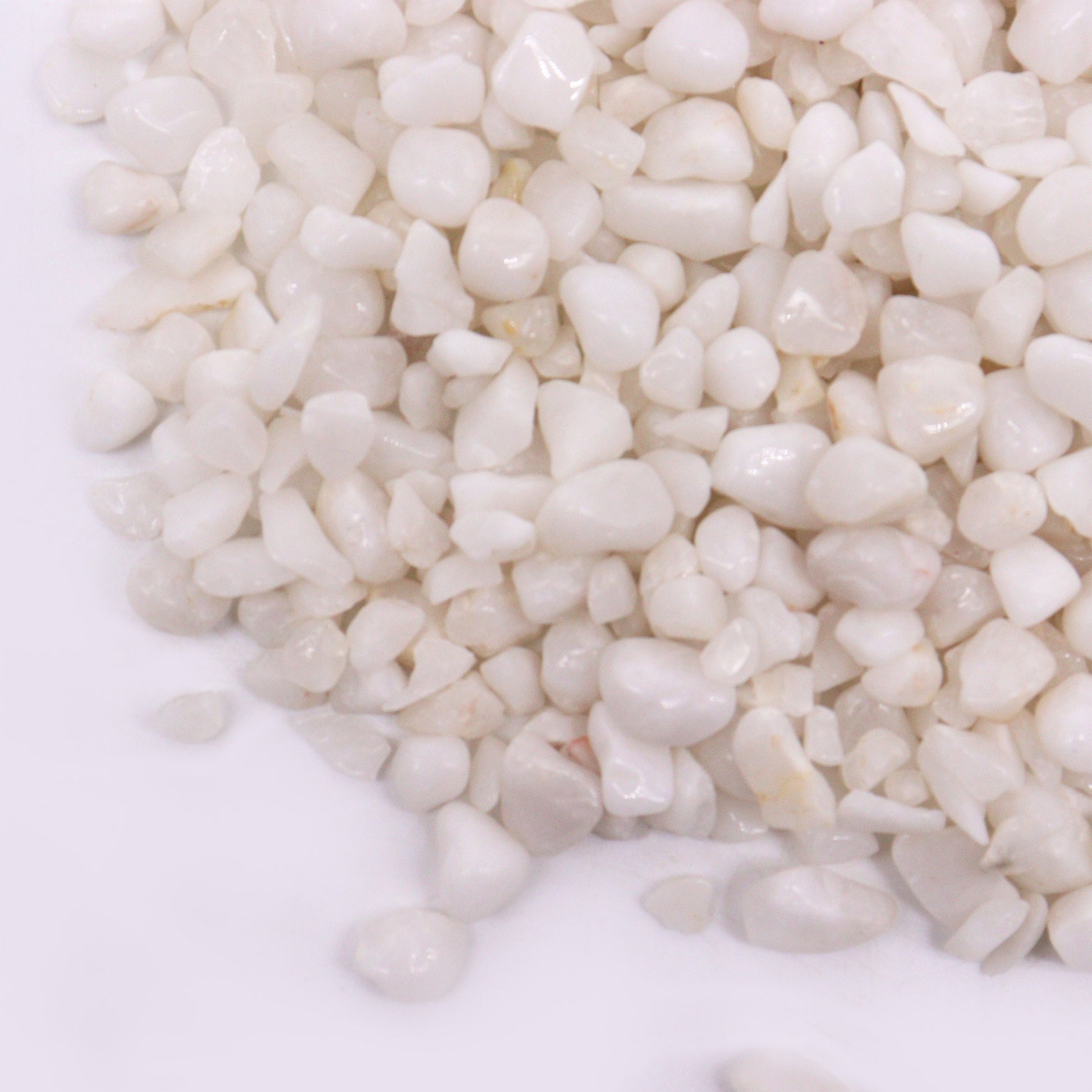 Polished white quartz gemstone chips with smooth texture from SGI Online