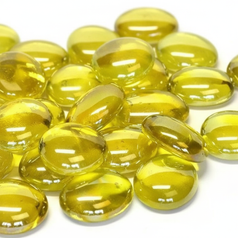 Close-up of yellow glass pebbles 15kg by STONED smooth and glossy decorative stones
