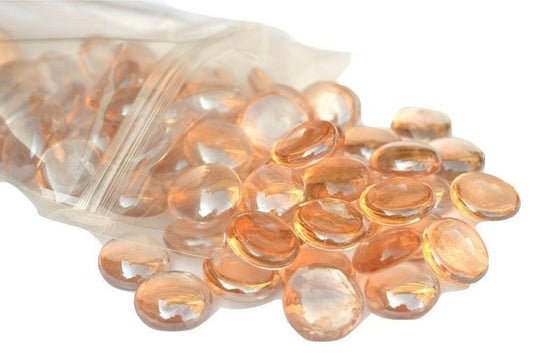 STONED 15kg peach glass pebbles spilling from a clear plastic bag with smooth round shapes SGI Online