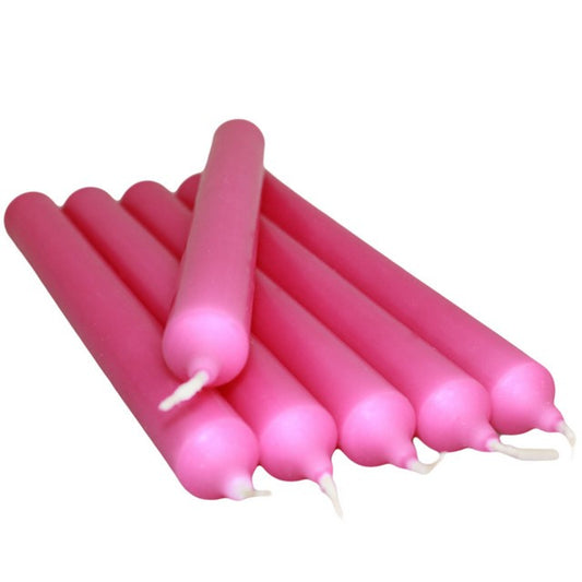 Set of SGI Online fuchsia dinner candles arranged in a stack with white wicks SGI Online