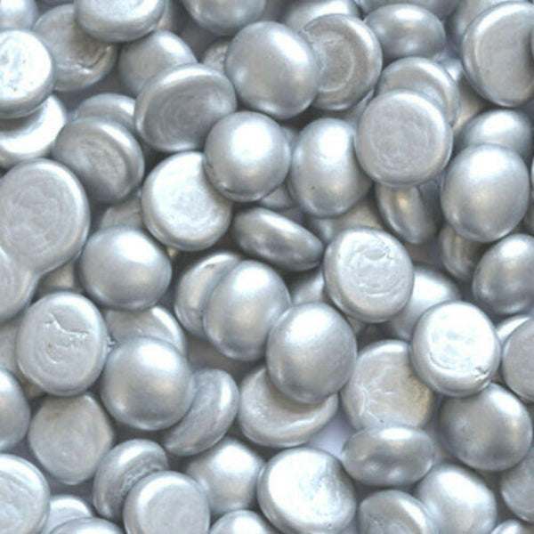 Close-up of STONED® metallic silver glass pebbles with smooth, rounded shapes and shiny finish