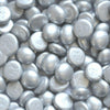 Close-up of STONED® metallic silver glass pebbles with smooth, rounded shapes and shiny finish
