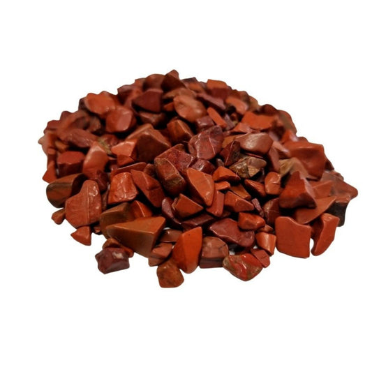 Pile of polished red jasper gemstone chips with smooth surfaces and rich reddish hues SGI Online