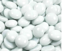 Close-up of STONED white glass pebbles with smooth and glossy finish for decoration